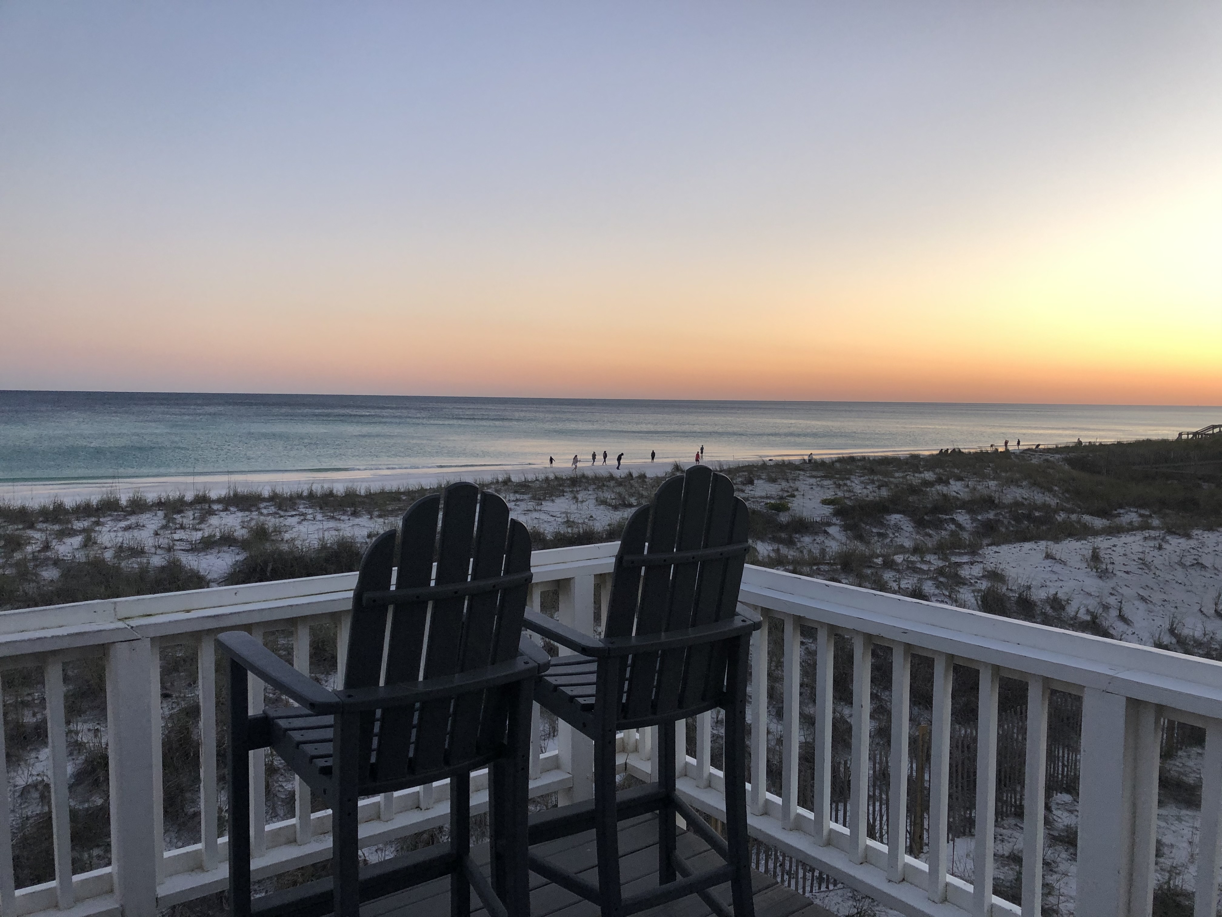 Dramatic clouds over beach at sunset