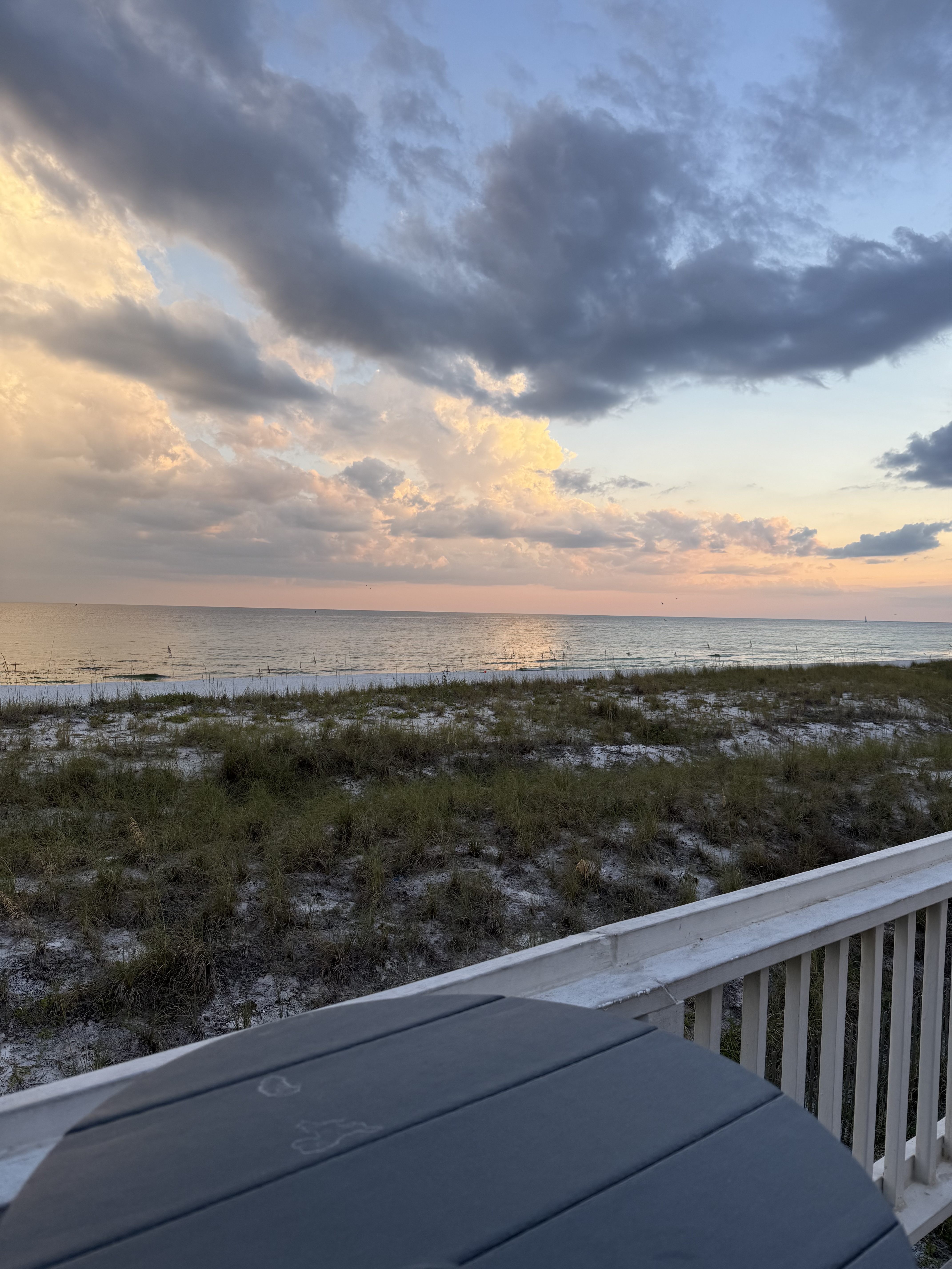 Sunset view from deck with Adirondack chairs